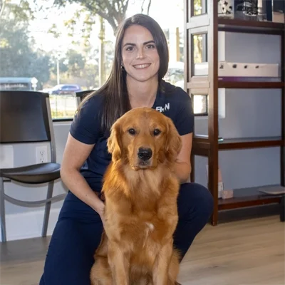 Chiropractor Tallahassee FL Shannon Lord With Sully Chiropractor Shannon Lord smiling with Sully.